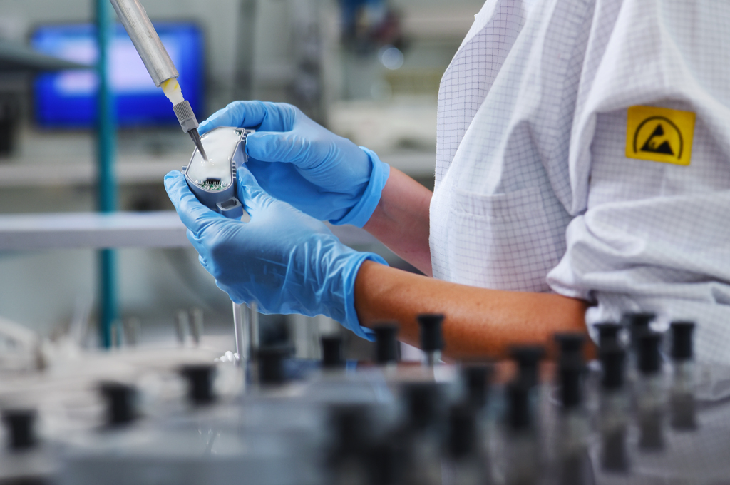Engineer inspecting electronics